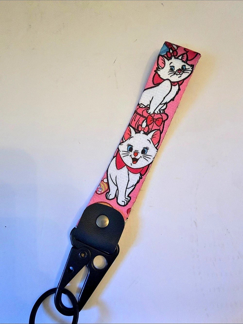 Disney Marie Print Keytag Wrist Keychain in Pink & Black
